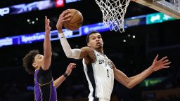 Victor Wembanyama rebounds against Jaxson Hayes of the Los Angeles Lakers.